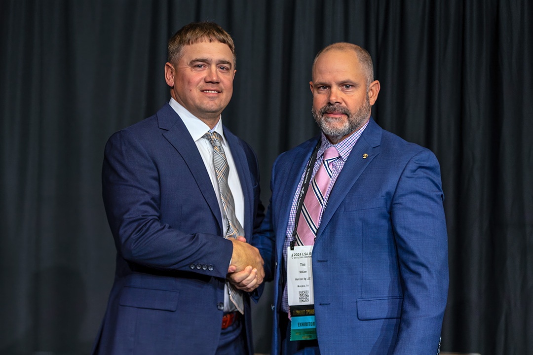 Michael Frugé receives congratulations from Horizon Ag CEO Dr. Tim Walker.
